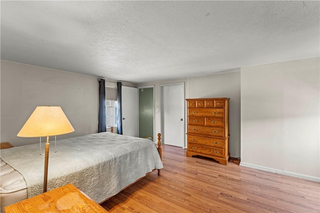 25 Iron St, Canonsburg, PA 15317 - bedroom with wood finished floors and a textured ceiling