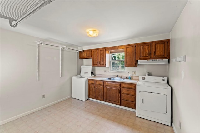 25 Iron St, Canonsburg, PA 15317 - kitchen featuring washer / clothes dryer, light floors, light countertops, and brown cabinetry