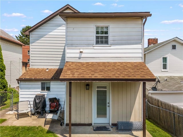25 Iron St, Canonsburg, PA 15317 - rear view of property featuring a patio area, a fenced backyard, and roof with shingles