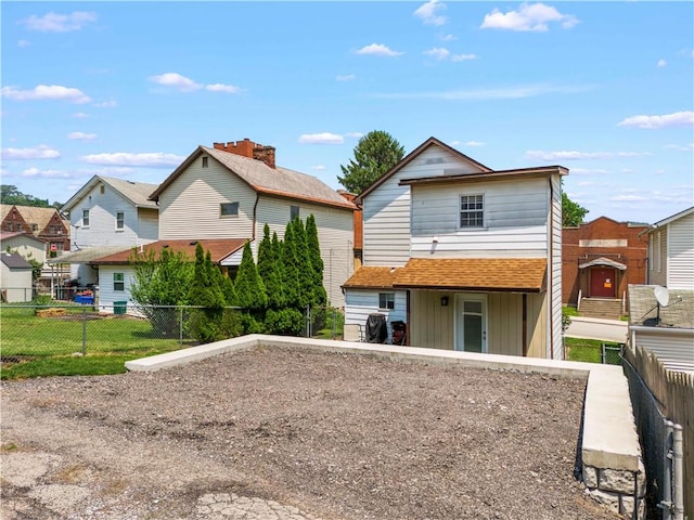 25 Iron St, Canonsburg, PA 15317 - rear view of property with board and batten siding and a residential view