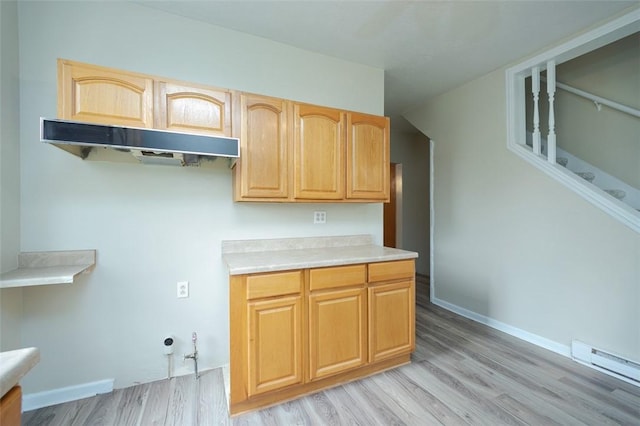 224 Mellon Ave, Donora, PA 15033 - kitchen featuring baseboard heating, light wood-style flooring, light countertops, and light brown cabinets