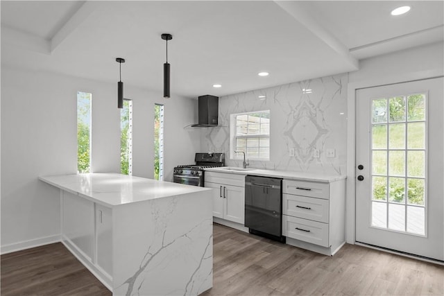 2513 Grove Rd, South Park, PA 15129 - kitchen with dishwashing machine, stainless steel range with gas stovetop, wall chimney exhaust hood, white cabinetry, and light stone countertops