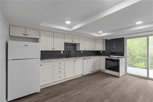 2513 Grove Rd, South Park, PA 15129 - kitchen with white appliances, a raised ceiling, light countertops, white cabinets, and recessed lighting