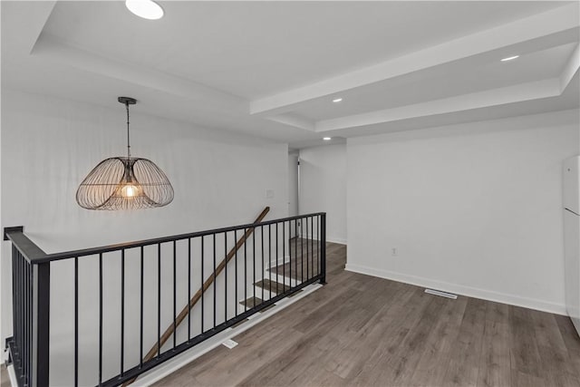 2513 Grove Rd, South Park, PA 15129 - corridor with an upstairs landing, wood finished floors, recessed lighting, a tray ceiling, and beamed ceiling
