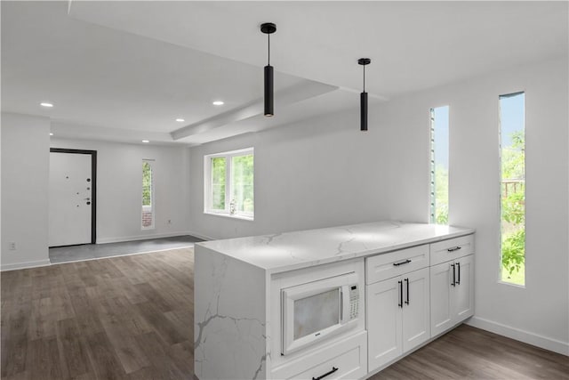 2513 Grove Rd, South Park, PA 15129 - kitchen featuring white microwave, wood finished floors, white cabinetry, light stone counters, and recessed lighting