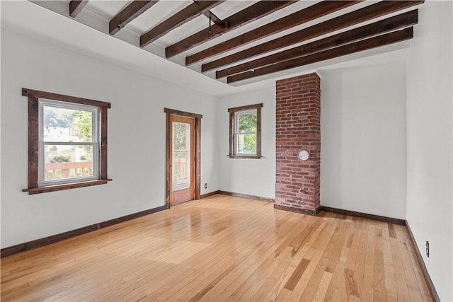 841 Stanton Ave, Millvale, PA 15209 - unfurnished room with beam ceiling, healthy amount of natural light, and light wood-type flooring