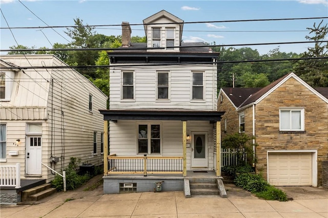 841 Stanton Ave, Millvale, PA 15209 - view of front of home featuring covered porch, a garage, and driveway