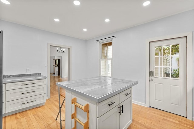 841 Stanton Ave, Millvale, PA 15209 - kitchen featuring stainless steel counters, plenty of natural light, light wood-type flooring, and recessed lighting
