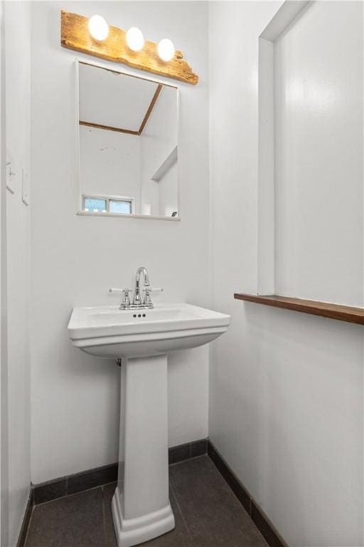 841 Stanton Ave, Millvale, PA 15209 - bathroom with baseboards and a sink