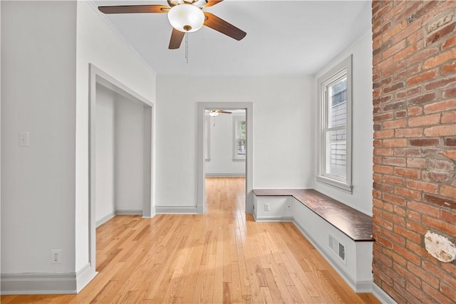841 Stanton Ave, Millvale, PA 15209 - mudroom with a ceiling fan, light wood-style flooring, brick wall, and crown molding