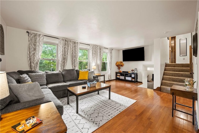 524 Sandy Hill Rd, Manor, PA 15642 - living room featuring healthy amount of natural light, wood-type flooring, and stairway