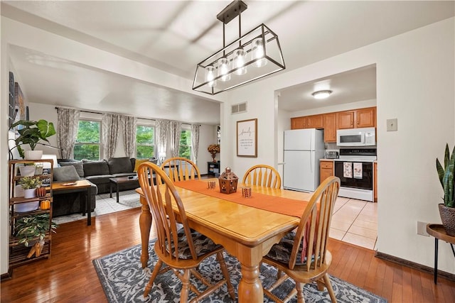 524 Sandy Hill Rd, Manor, PA 15642 - dining room featuring wood-type flooring and a chandelier