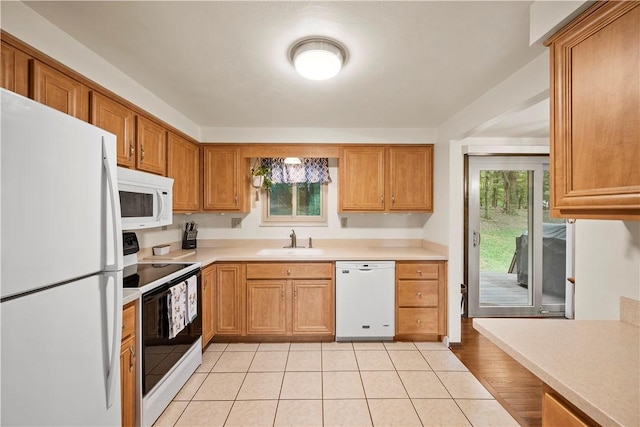 524 Sandy Hill Rd, Manor, PA 15642 - kitchen featuring white appliances, light countertops, and brown cabinets