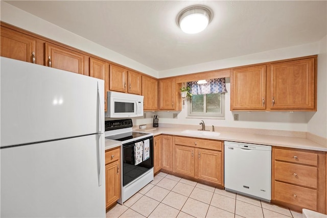 524 Sandy Hill Rd, Manor, PA 15642 - kitchen featuring white appliances, light countertops, light tile patterned floors, and brown cabinetry