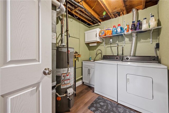 524 Sandy Hill Rd, Manor, PA 15642 - laundry area featuring cabinet space, water heater, washing machine and clothes dryer, and wood finished floors