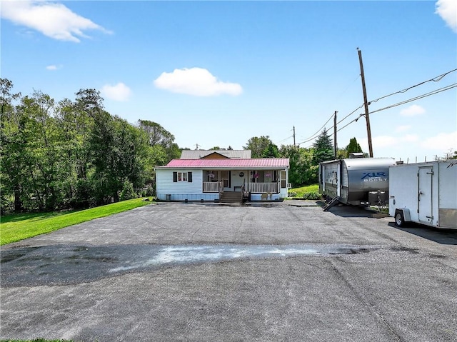 260 Stouffer Hill Rd, Somerset Twp, PA 15541 - view of front of house with covered porch and uncovered parking