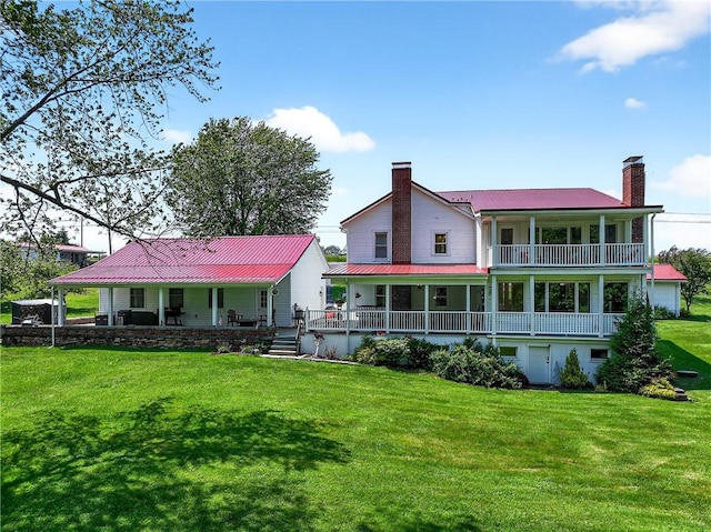 260 Stouffer Hill Rd, Somerset Twp, PA 15541 - rear view of property with a chimney, covered porch, a lawn, and a metal roof