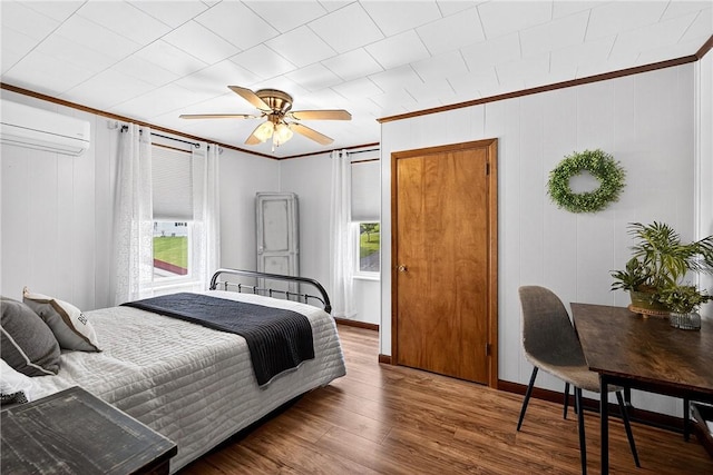 260 Stouffer Hill Rd, Somerset Twp, PA 15541 - bedroom featuring crown molding, an AC wall unit, wood finished floors, and ceiling fan