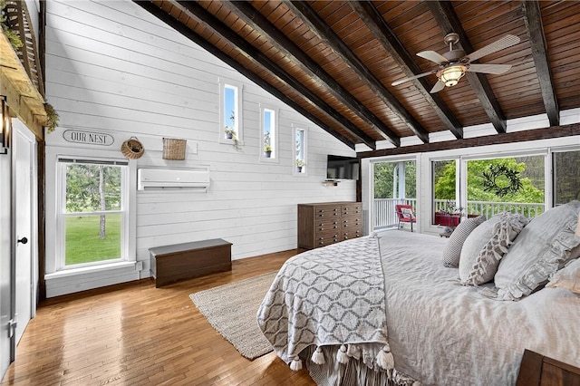 260 Stouffer Hill Rd, Somerset Twp, PA 15541 - bedroom with wooden ceiling, a wall mounted AC, wooden walls, and wood-type flooring