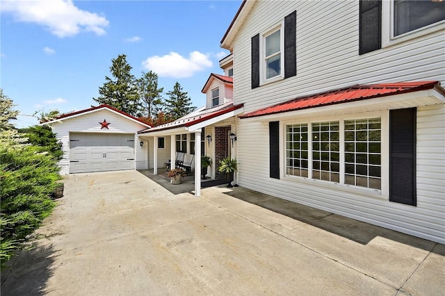 260 Stouffer Hill Rd, Somerset Twp, PA 15541 - view of home's exterior featuring concrete driveway, a garage, and an outdoor structure