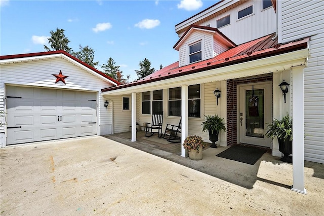 260 Stouffer Hill Rd, Somerset Twp, PA 15541 - view of side of property with a porch, a metal roof, a garage, and driveway