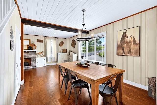 260 Stouffer Hill Rd, Somerset Twp, PA 15541 - dining area with wood finished floors, a wood ceiling with exposed beams, a stone fireplace, a chandelier, and crown molding
