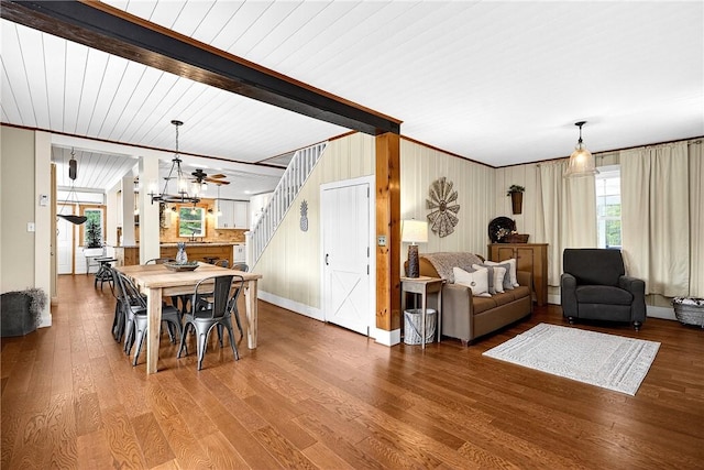 260 Stouffer Hill Rd, Somerset Twp, PA 15541 - dining room featuring plenty of natural light, wood finished floors, stairs, a chandelier, and beam ceiling