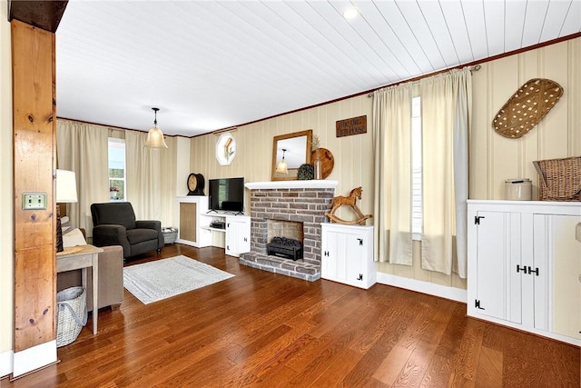 260 Stouffer Hill Rd, Somerset Twp, PA 15541 - living room with wood finished floors, a brick fireplace, and ornamental molding