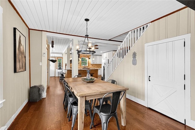 260 Stouffer Hill Rd, Somerset Twp, PA 15541 - dining area featuring wood finished floors, wood ceiling, a chandelier, ornamental molding, and wood walls