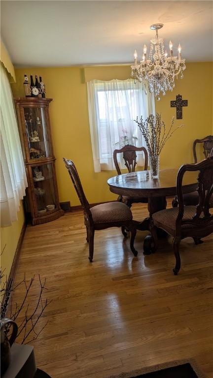 218 Bascom, Observatory Hill, PA 15214 - dining room with a chandelier and light wood-style flooring