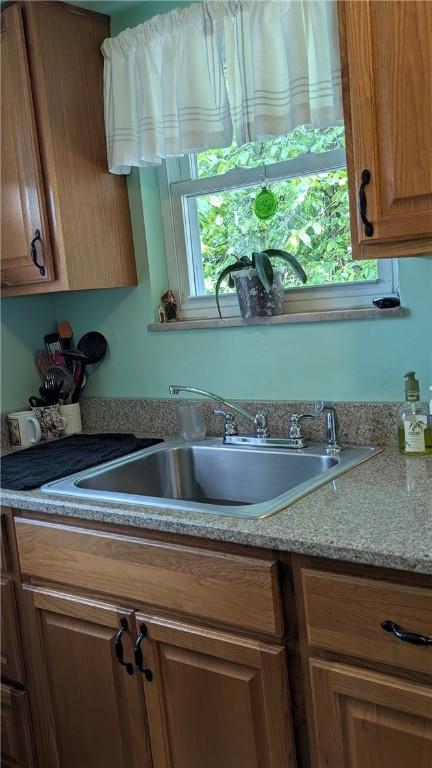 218 Bascom, Observatory Hill, PA 15214 - kitchen featuring brown cabinetry and light countertops