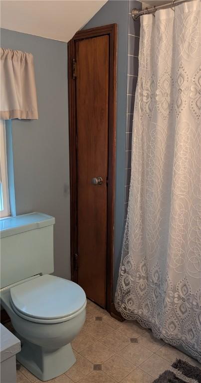 218 Bascom, Observatory Hill, PA 15214 - bathroom with vaulted ceiling, a shower with shower curtain, tile patterned floors, and vanity