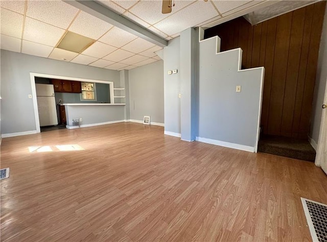 420 Reed St, Sharon, PA 16146 - unfurnished living room with a paneled ceiling and wood finished floors