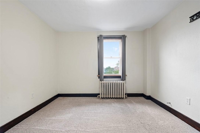 22 Beltzhoover Ave, Allentown, PA 15210 - spare room featuring radiator heating unit and carpet floors