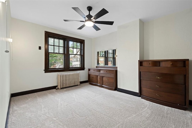22 Beltzhoover Ave, Allentown, PA 15210 - bedroom featuring radiator heating unit, carpet floors, and ceiling fan
