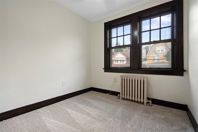 22 Beltzhoover Ave, Allentown, PA 15210 - carpeted empty room with radiator heating unit and lofted ceiling
