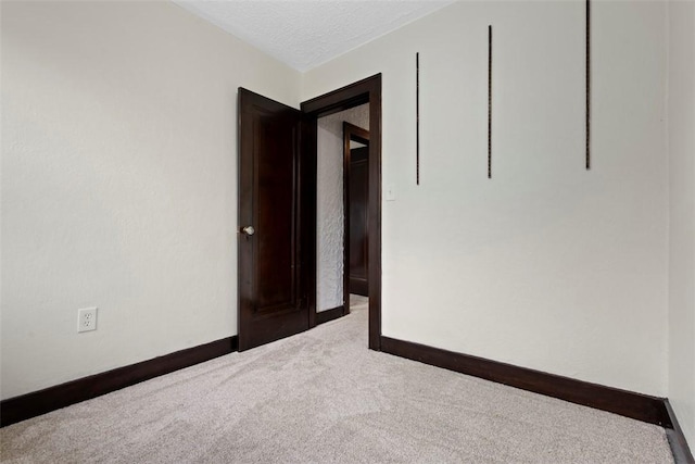 22 Beltzhoover Ave, Allentown, PA 15210 - empty room with carpet floors and a textured ceiling