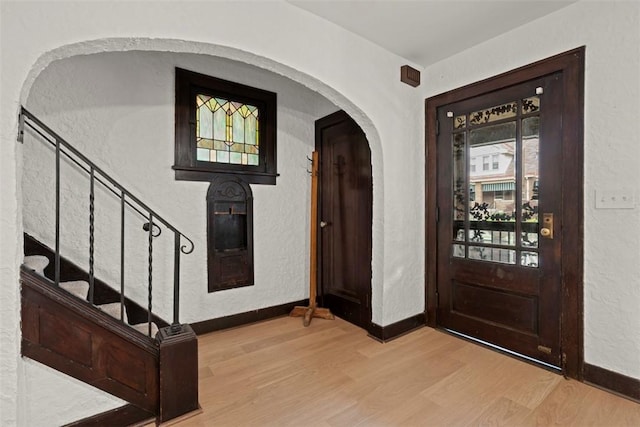 22 Beltzhoover Ave, Allentown, PA 15210 - entrance foyer with wood finished floors, stairway, and a textured wall
