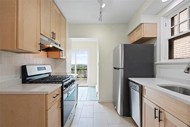 22 Beltzhoover Ave, Allentown, PA 15210 - kitchen featuring under cabinet range hood, appliances with stainless steel finishes, light brown cabinets, backsplash, and light tile patterned floors