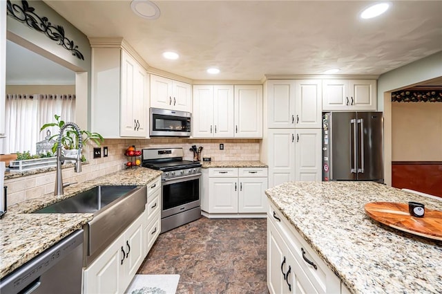 4025 Holiday Park Dr, Murrysville, PA 15668 - kitchen featuring stainless steel appliances, backsplash, recessed lighting, stone finish flooring, and light stone counters