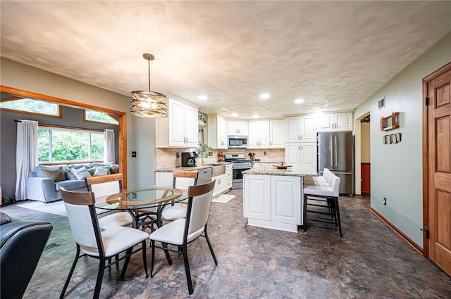4025 Holiday Park Dr, Murrysville, PA 15668 - dining space with recessed lighting and baseboards
