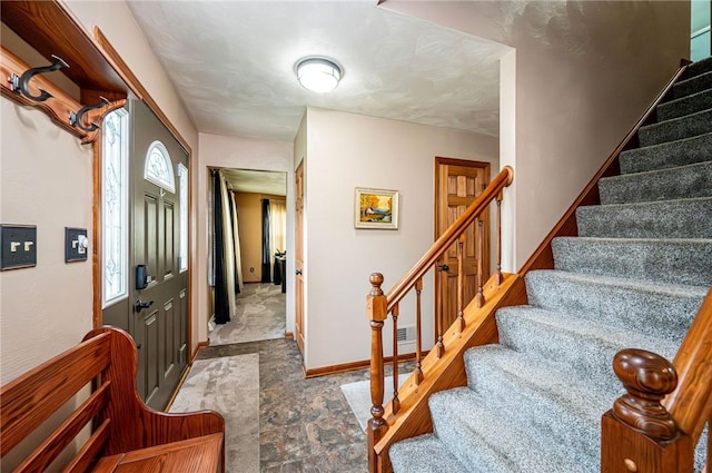 4025 Holiday Park Dr, Murrysville, PA 15668 - entryway featuring stairway and stone finish flooring