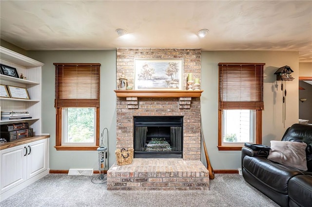4025 Holiday Park Dr, Murrysville, PA 15668 - living room with carpet, a brick fireplace, and healthy amount of natural light