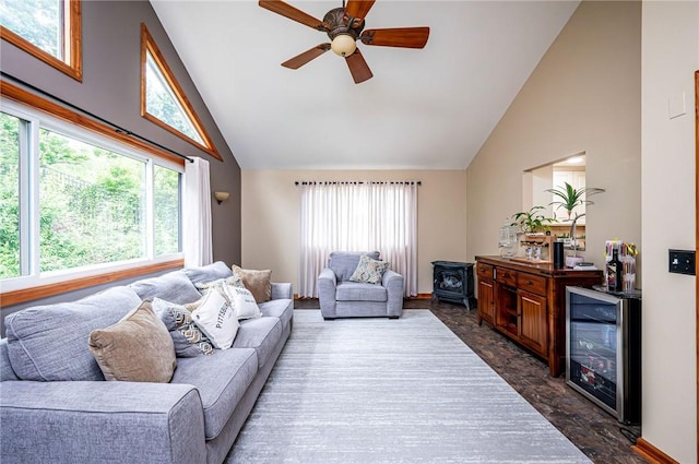 4025 Holiday Park Dr, Murrysville, PA 15668 - living area featuring wine cooler, healthy amount of natural light, high vaulted ceiling, a ceiling fan, and a wood stove
