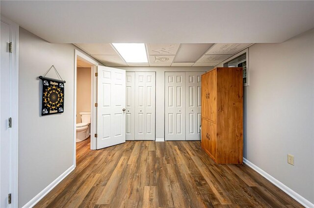 4025 Holiday Park Dr, Murrysville, PA 15668 - unfurnished bedroom featuring wood finished floors and a paneled ceiling