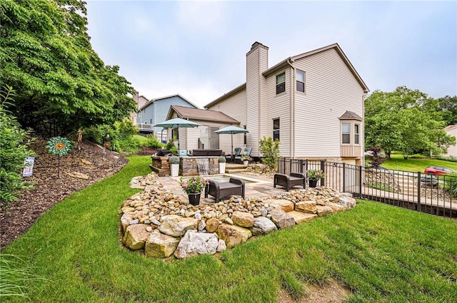 4025 Holiday Park Dr, Murrysville, PA 15668 - back of property featuring a patio, an outdoor kitchen, and a chimney