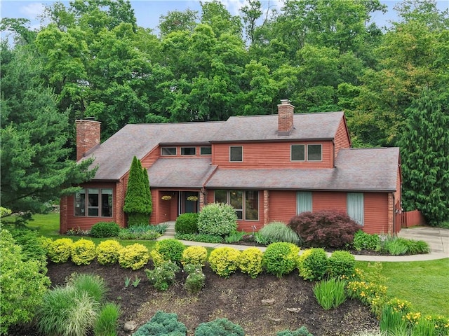 2507 Sarah Ct, Murrysville, PA 15668 - view of front facade with a chimney and roof with shingles