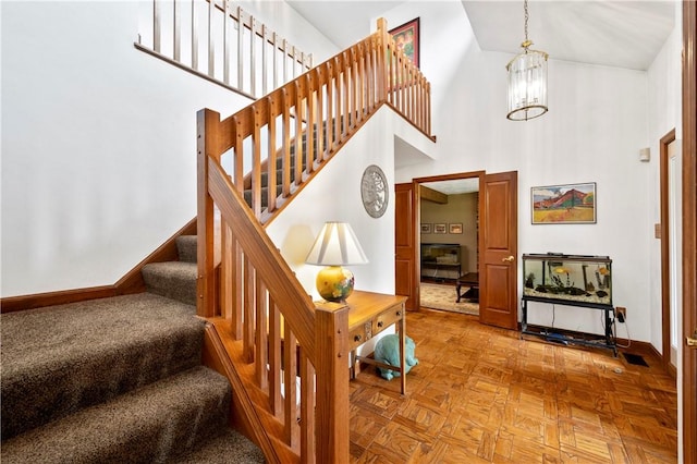 2507 Sarah Ct, Murrysville, PA 15668 - stairs with a towering ceiling and a chandelier
