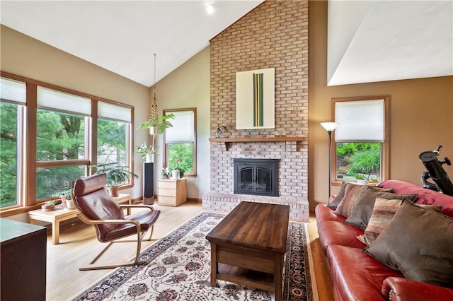 2507 Sarah Ct, Murrysville, PA 15668 - living area featuring wood finished floors, a brick fireplace, and high vaulted ceiling