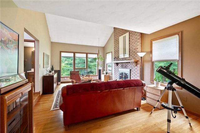 2507 Sarah Ct, Murrysville, PA 15668 - living area with light wood-type flooring, a fireplace, and vaulted ceiling